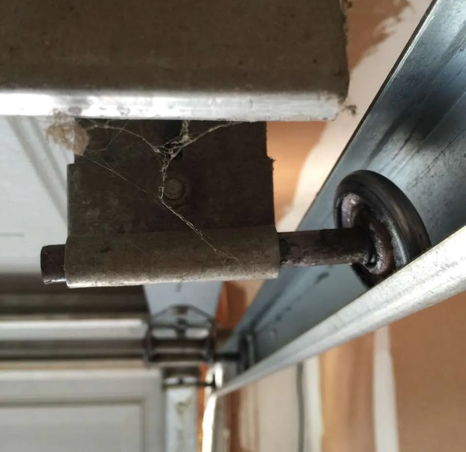   Indicators of worn-out garage door rollers include unusual noises, jerky movements, and misalignment during operation.