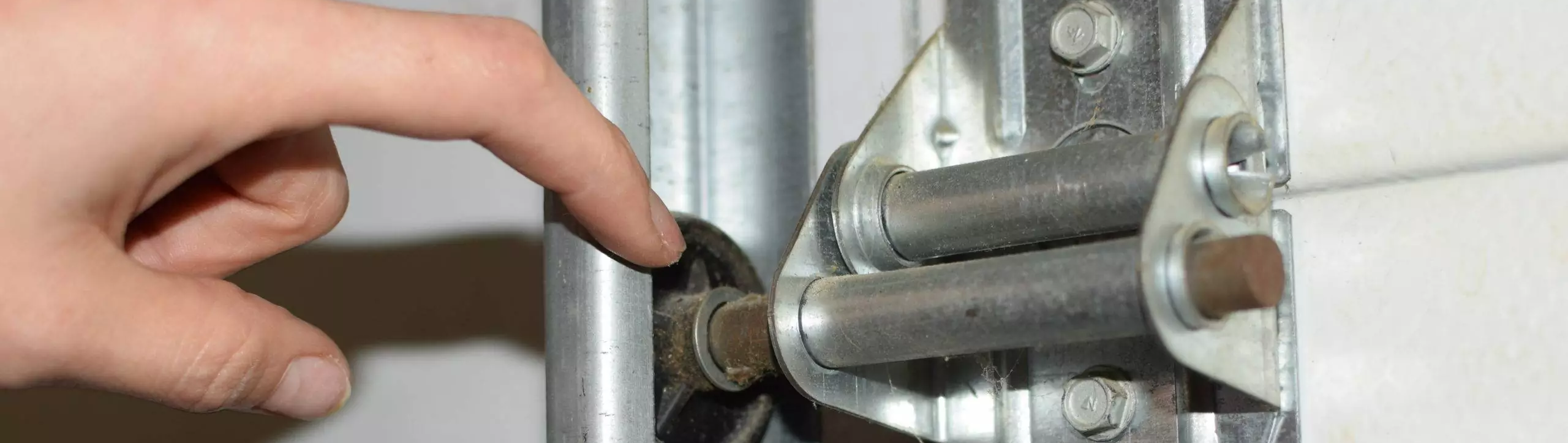 Roll up door roller replacement and repair for quiet operation and optimal movement of sectional doors.