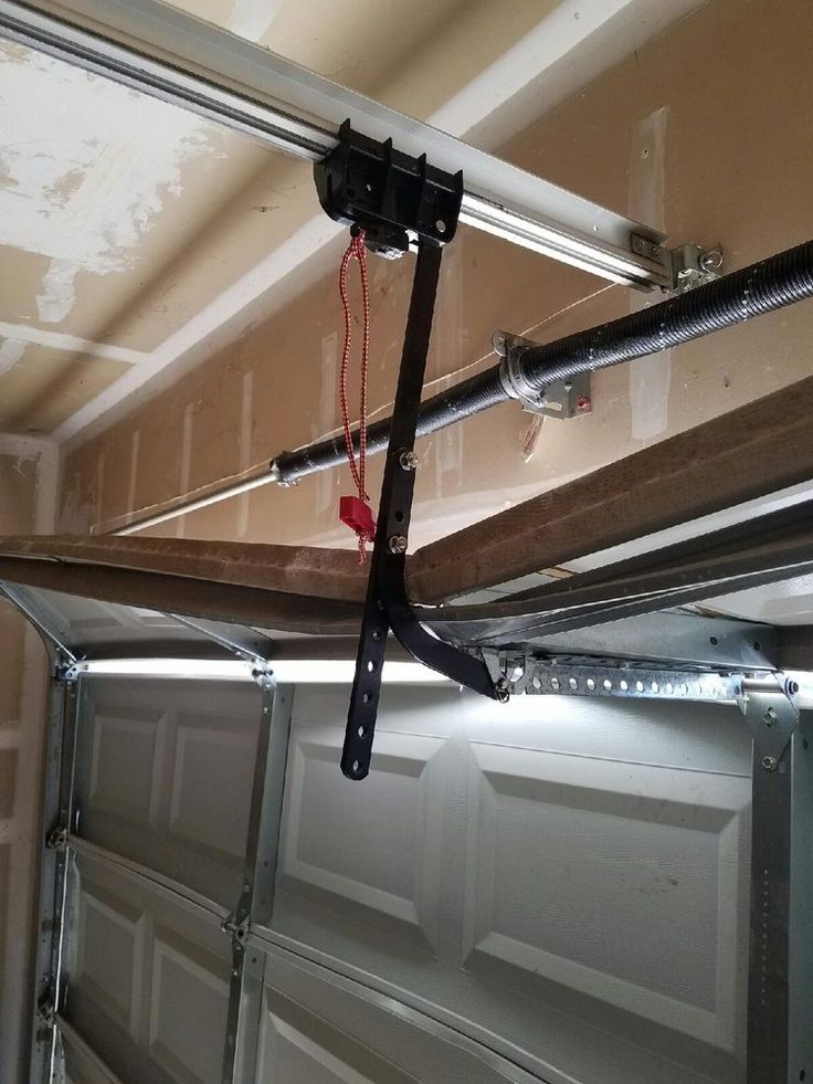   Broken or worn-out garage door spring needing repair in Baltimore, MD, causing difficulty in door operation.